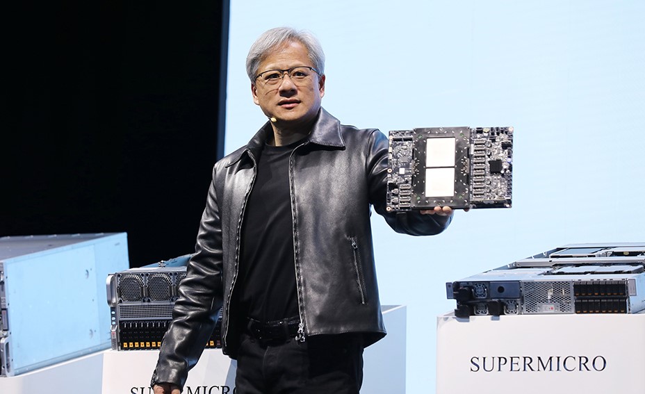 Jensen Huang, President of NVIDIA holding the Grace hopper superchip CPU used for generative AI at supermicro keynote presentation during the COMPUTEX 2023